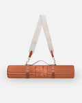 Hercule Studio terracotta nomad bundle with the Archy arch-shaped sport mat and the elegant mat carrying strap, practical solution for Pilates, yoga and fitness on the move, durable Made in France design, duo product packshot
