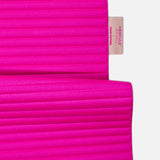 Custom Hercule Studio x From Future label detail on the Candy Pink cashmere sport mat, premium finish
