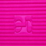 Close-up on the fuchsia pink cashmere texture and embossed H logo of the Hercule Studio x From Future Candy Pink sport mat