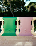 Hercule Studio yoga mat, “Mar” model, in golf green and lavender, on a balcony