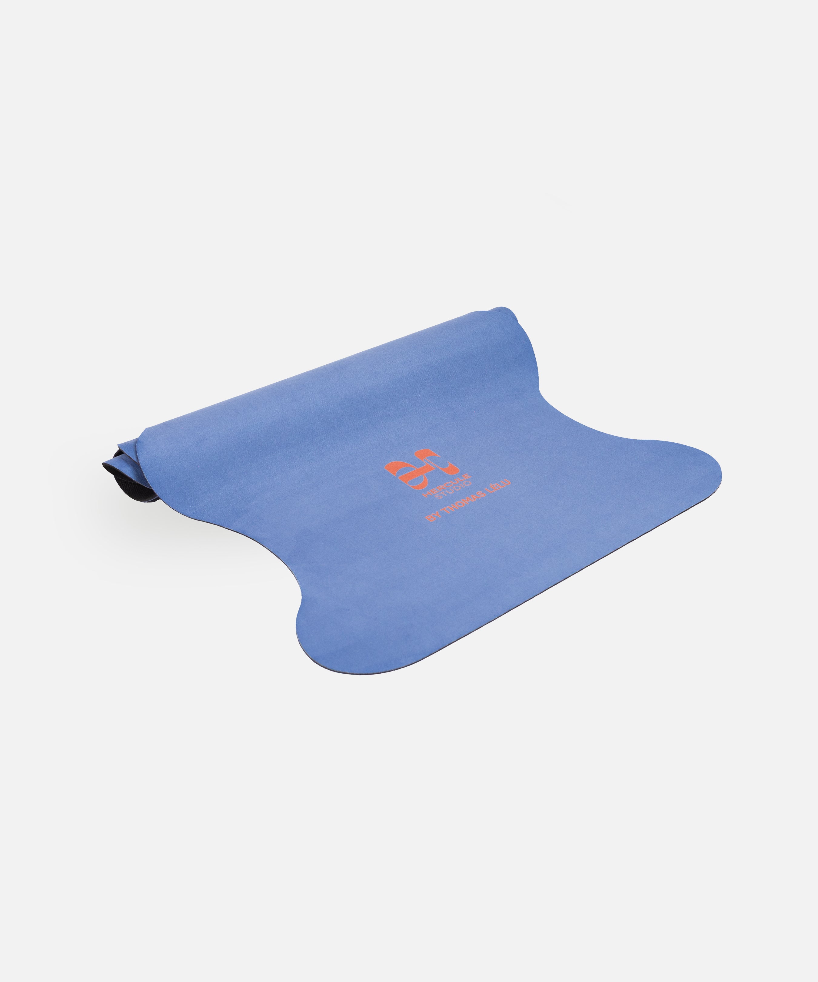 Half-rolled view of the Hercule Studio Thomas Lélu design yoga mat, limited edition quote mat, durable suede material