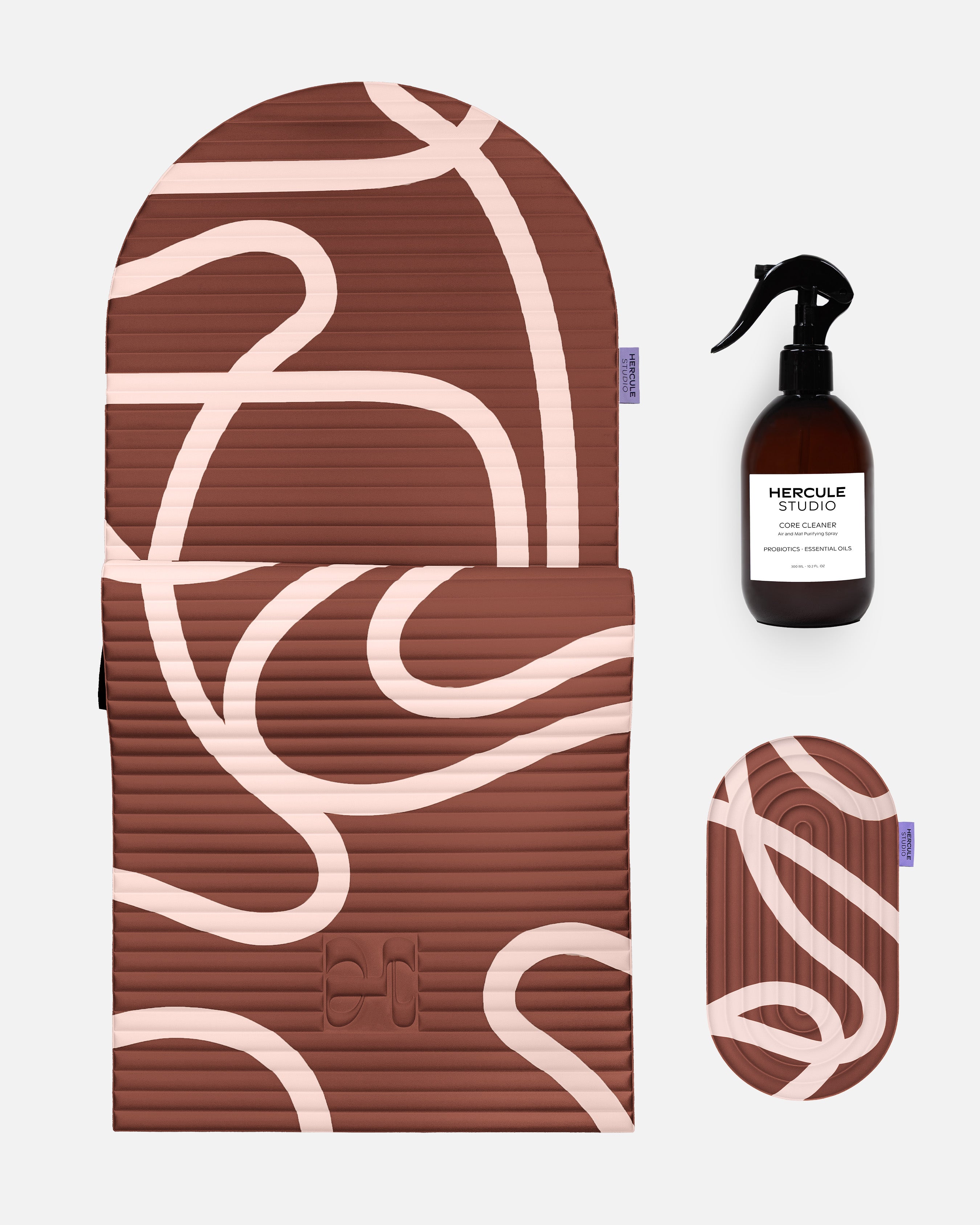 Hercule Studio Bari Choco printed essential bundle with the brown graphic Archy mat, the Galé 3-in-1 comfort pad and the sport mat sanitizing spray, durable made in France Pilates and fitness bundle, packshot